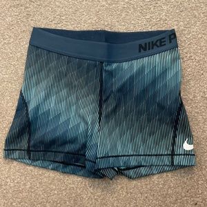 Blue patterned nike pros